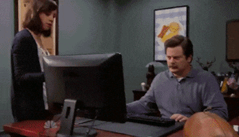 Ron Swanson throwing his PC at a dumpster